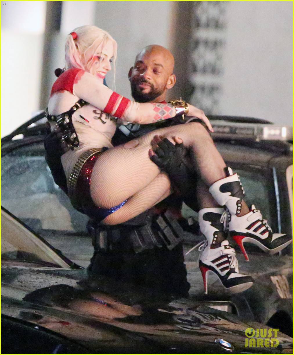 136928, EXCLUSIVE: Will Smith seen picking up Margot Robbie while filming 'Suicide Squad' in full costume. The Cast was filming on Bay street at 4am. The scene had fake rain that was pouring down on the stars and all seemed in good spirits about it. In movie Will Smith is seen as Deadshot, Margot Robbie as Harley Quinn, Jay Hernandez as El Diablo, Adam Beach, Adewale Akinnuoye-Agbaje as Killer Croc, Jai Courtney as Captain Boomerang, and Karen Fukuhara as Plastique. Will and Margot are re-united for the film after starring in the movie 'Focus' together, released in early 2015. Toronto, Canada - Saturday May 09, 2015. CANADA OUT Photograph: © PacificCoastNews. Los Angeles Office: +1 310.822.0419 sales@pacificcoastnews.com FEE MUST BE AGREED PRIOR TO USAGE